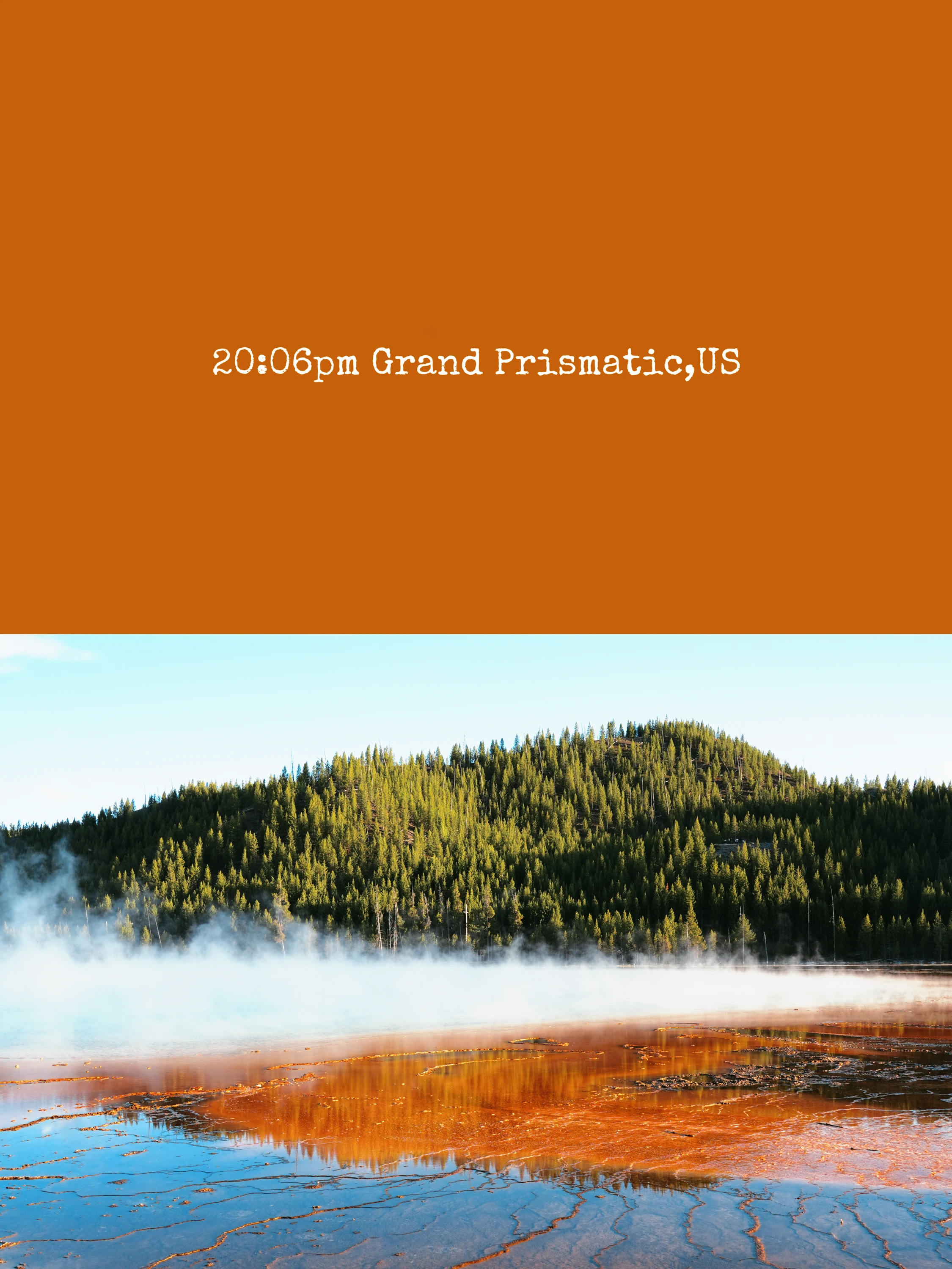 Field note, Grand Prismatic: steam drifting across orange runoff below a forested ridge.